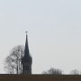 Přede mnou se objevuje věžička kostela v Suchdole nad Odrou.